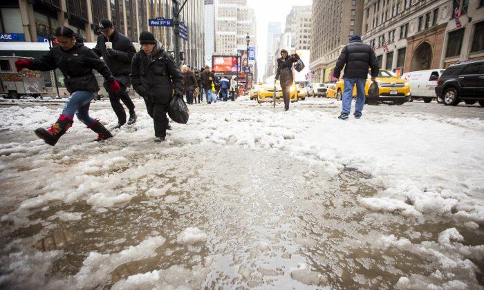 Slush in The City: New Yorkers Navigate After Lastest Dump (Photos)