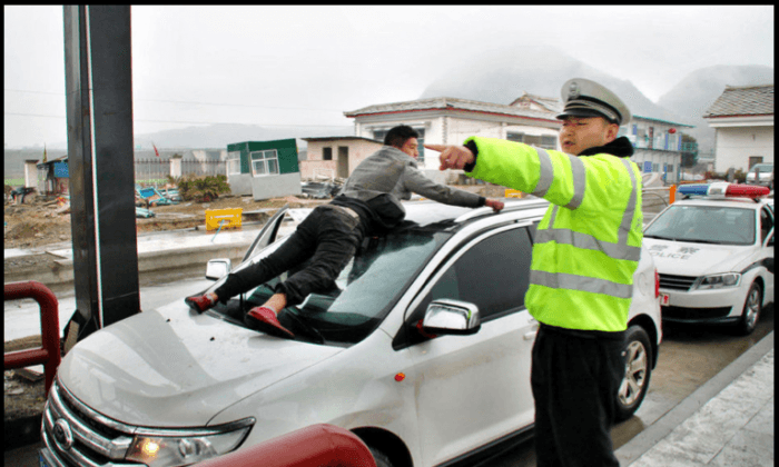 Chinese Man Clutches Onto Speeding Car During Dispute