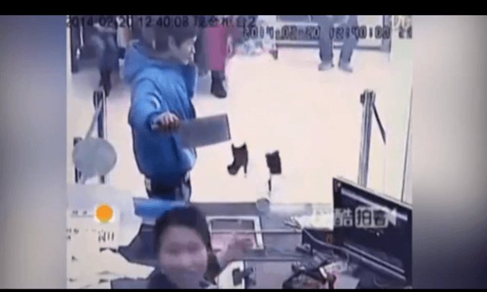 Video: Bank Teller Laughs at Knife-Wielding Robber in China