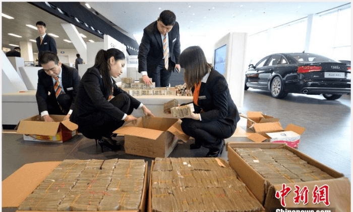 Chinese Man Buys Audi With Vanload of Cash