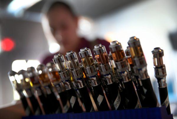 Electronic cigarettes with different flavored E-liquid are seen on display at the Vapor Shark store in Miami, Fla., on Feb. 20, 2014. (Joe Raedle/Getty Images)