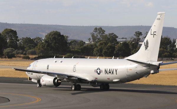 A U.S. Navy plane P-8 Poseidon takes off from Perth Airport in 2014. (AP Photo/Rob Griffith)