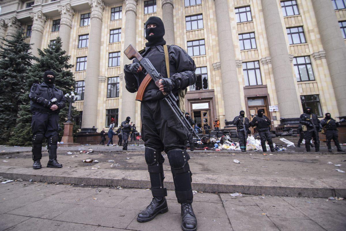 Members of a special police unit guard the regional administration building in Kharkiv, Ukraine, on April 8, 2014.  (Olga Ivashchenko/AP Photo)