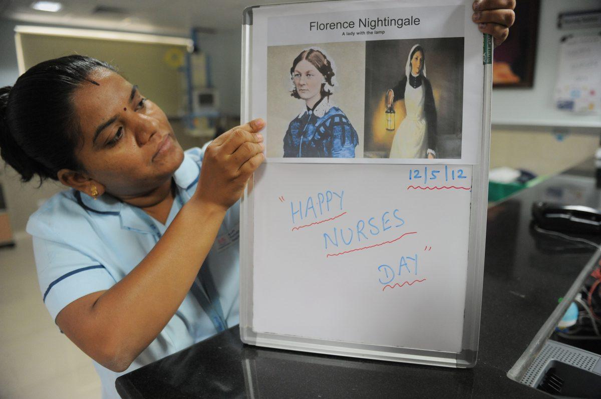 An Indian nurse arranges pictures of Florence Nightingale at a hospital in Ahmedabad on May 12, 2012. May 12 is celebrated as International Nurses Day to honour the birthday of Florence Nightingale, widely considered to be the founder of modern nursing. (Sam Panthaky/AFP/Getty Images)