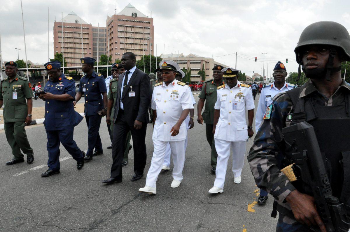 Nigeria's chief of defense staff, Air Marshal Alex S. Badeh, second from left, and other army chiefs arrive to address the Nigerians Against Terrorism group during a demonstration calling on the government to rescue the kidnapped girls of the government secondary school in Chibok, in Abuja, Nigeria, on May 26, 2014. (Gbenga Olamikan/AP Photo)
