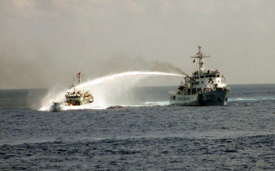 On May 7, a Chinese Coast Guard vessel (Right) fires a water cannon at a Vietnamese vessel off the coast of Vietnam. China insisted it had every right to drill for oil off Vietnam's coast and warned its neighbor to leave the area around the deep-sea rig where Chinese and Vietnamese ships are engaged in a tense standoff. The United States warned both sides to de-escalate tensions and urged China to clarify its claims to the territory. (Vietnam Coast Guard/AP Photo)