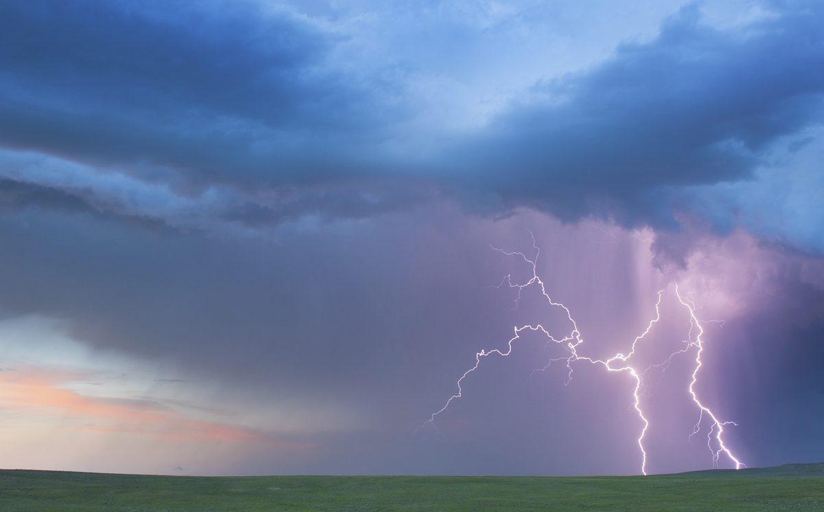 Cloud-to-ground lightning bolts strike a field in eastern Wyoming. (Jim Reed)