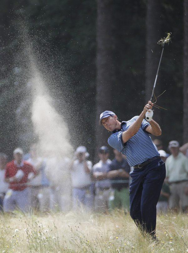 Matt Kuchar hits out of the native area on the 12th hole during the first round of the U.S. Open golf tournament in Pinehurst, N.C., on June 12, 2014. (David Goldman/AP Photo)