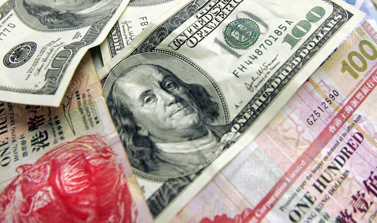 Hong Kong and U.S. dollars in Hong Kong on Jan. 12, 2008. The Hong Kong dollar is a currency pegged to the U.S. dollar. Under the LERS, HK$1,000 is worth $127 as of Jul. 22, 2022. (Laurent Fievet/AFP/Getty Images)