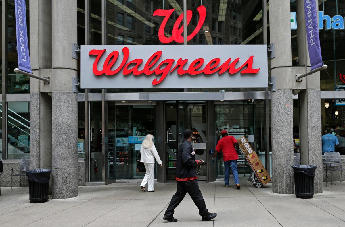 Walgreen Co.—which bills itself as “America’s premier pharmacy”— is among many companies considering combining operations with foreign businesses to trim their tax bills. These deals, called inversions, have raised concerns among some U.S. lawmakers over the potential for lost tax revenue. (AP Photo/Charles Krupa)