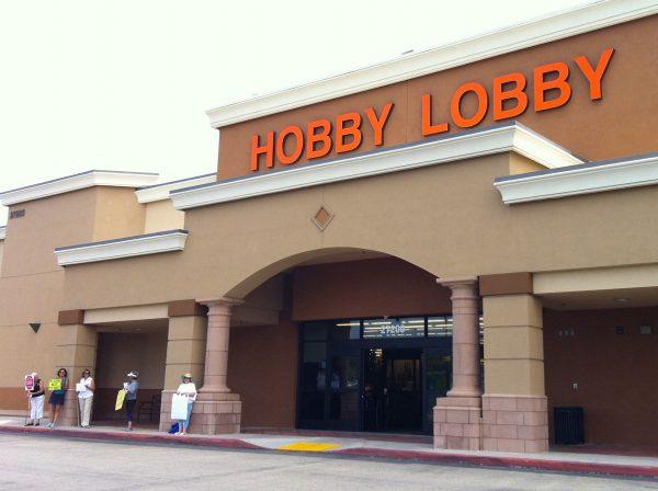 A group of protesters stands in front of a Hobby Lobby store in Laguna Niguel, California. (Sarah Le/Epoch Times)