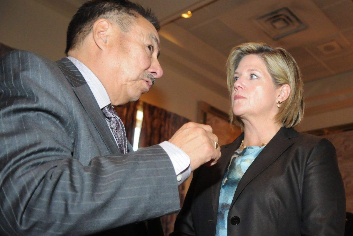 Ontario Regional Chief Stan Beardy speaks with the province's NDP leader Andrea Horwath in Thunder Bay in September 2011. (The Canadian Press/Brent Linton)