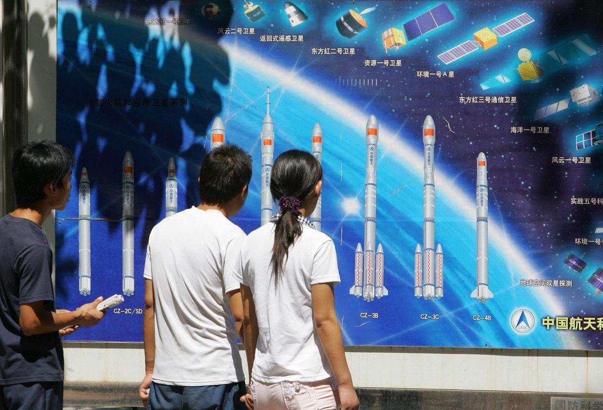 People look at a display of China's rockets and space program in Beijing on Aug. 29, 2007. The Chinese regime recently tested an anti-satellite missile. (Frederic J. Brown/AFP/Getty Images)