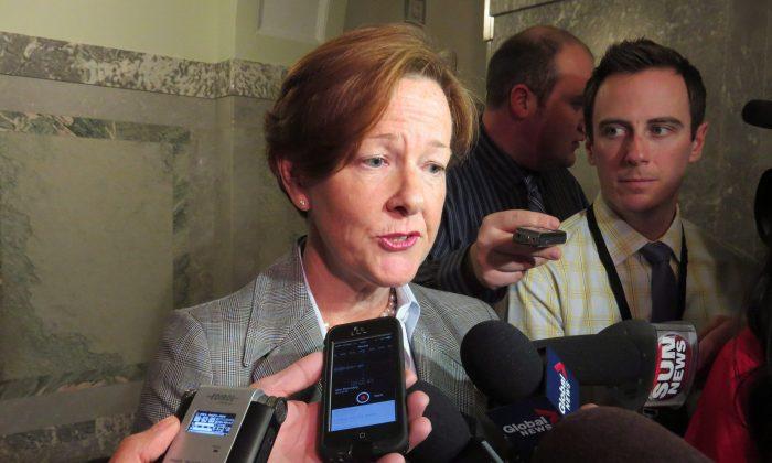 Alberta Premier Wants RCMP Review of Travel Expenses; Redford Quits 