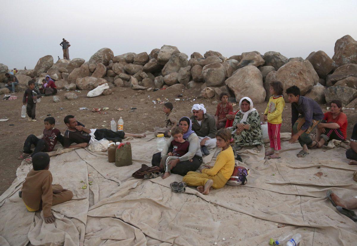 Displaced Iraqis from the Yazidi community settle at a camp in Derike, Syria, on Aug. 10, 2014. (Khalid Mohammed/AP Photo)