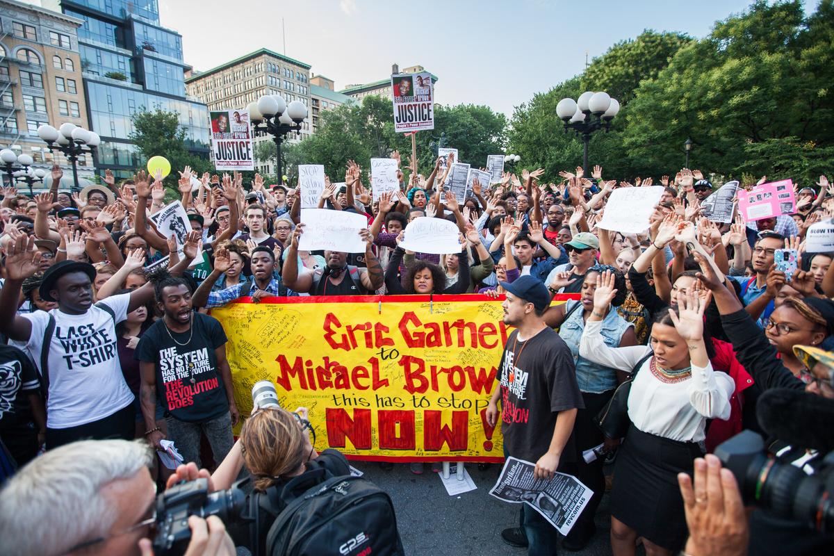City Protests Join National Moment of Silence for Missouri Teen