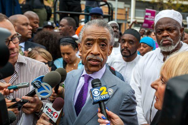 Rev. Al Sharpton speaks to the media during a rally against police brutality on Staten Island, N.Y. on Aug. 23, 2014. (Petr Svab/The Epoch Times)