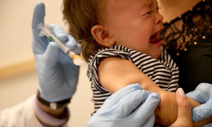 A baby cries as a pediatrician administers a measles vaccination during a visit to the Miami Children's Hospital on June 2, 2014, in Miami, Florida. (Joe Raedle/Getty Images)