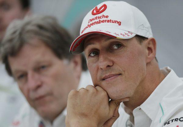 Former Mercedes F1 driver Michael Schumacher of Germany pauses during a news conference to announce his retirement from Formula One at the end of 2012 in Suzuka, Japan, Oct. 4, 2012. (Shizuo Kambayashi/AP Photo)