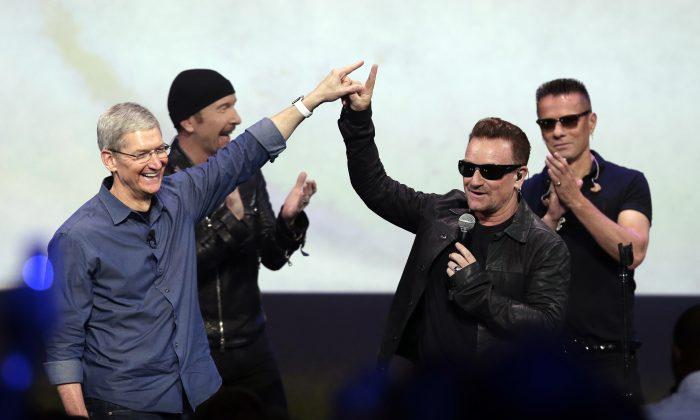 Why Your iTunes Had a Free U2 Album “Songs of Innocence” 