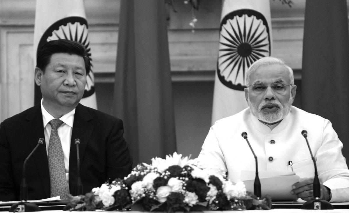 Chinese leader Xi Jinping (L) speaks at joint press conference with Indian Prime Minister Narendra Modi in New Delhi on Sept. 18, 2014. India’s prime minister expressed concern about incidents on the two countries’ disputed border, as a standoff between troops at the frontier overshadowed key talks. (Raveendran/AFP/Getty Images)