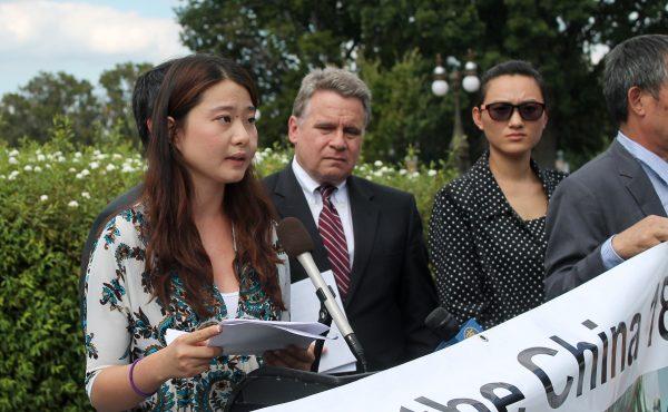 Grace (GeGe) Ge, daughter of human rights lawyer Gao Zhisheng, speaks at a news conference on Sept. 17, 2014, outside the Capitol Building in Washington, D.C. Next to her is Congressman Chris Smith (R-N.J.). (Tiffany Wu/The Epoch Times)