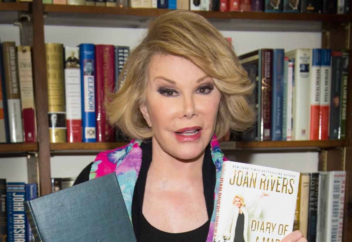 Television personality and talk show host Joan Rivers makes an appearance at the Book Revue to promote her new memoir, "Diary of a Mad Diva," in Huntington, New York, on July 25, 2014. (Scott Roth/Invision/AP)