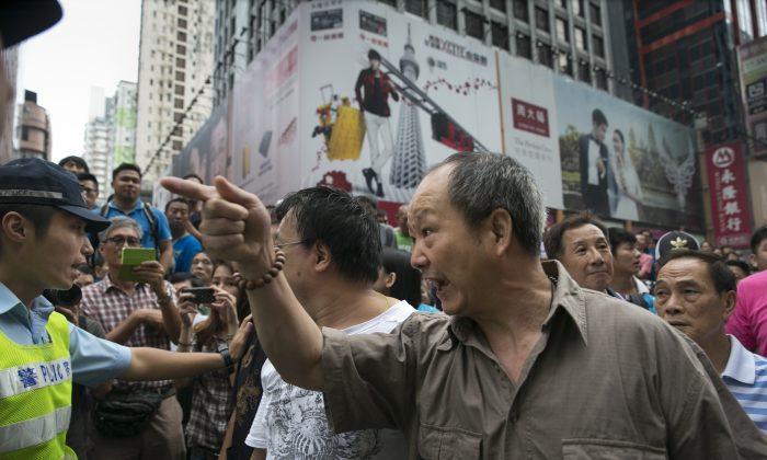 Hong Kong Police Linked to Protesters Opposing Democracy Movement