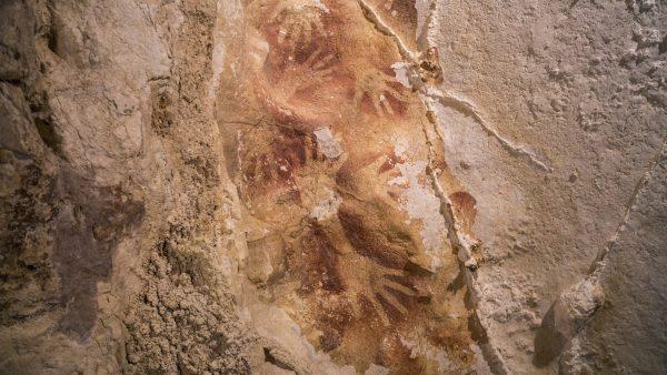 Stencils of hands in a cave in Indonesia. Ancient cave drawings in Indonesia are as old as famous prehistoric art in Europe, according to a new study that shows our ancestors were drawing all over the world 40,000 years ago. And it hints at an even earlier dawn of creativity in modern humans than scientists had thought. (AP Photo/Kinez Riza, Nature Magazine)