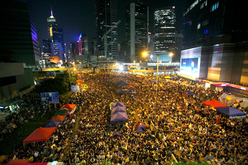 Thousands of pro-democratic protesters fill what they are now calling "Umbrella Square," in the Central District of Hong Kong on Oct. 10, 2014. Thousands came in support of the protest after the government canceled today's talks with the organizers of the movement. (Benjamin Chasteen/The Epoch Times)