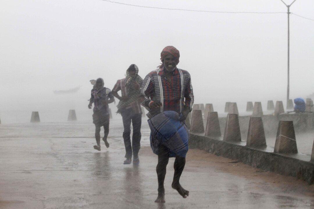 Strong Cyclone Lashes India; Typhoon Vongfong Hits Japan