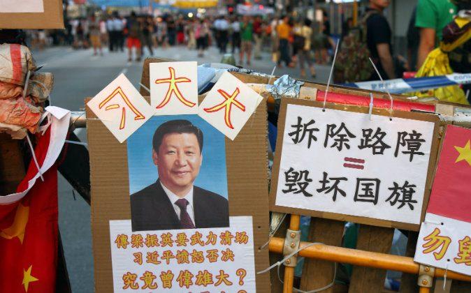 A Lighter Side: Xi Jinping’s Portrait ‘Protects’ Occupy Central Barricades