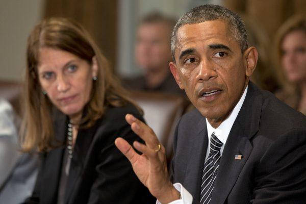 President Barack Obama next to Health and Human Services Secretary Sylvia Burwell, speaks to the media about Ebola during a meeting in the Cabinet Room of the White House in Washington on Oct. 15, 2014. (AP Photo/Jacquelyn Martin)