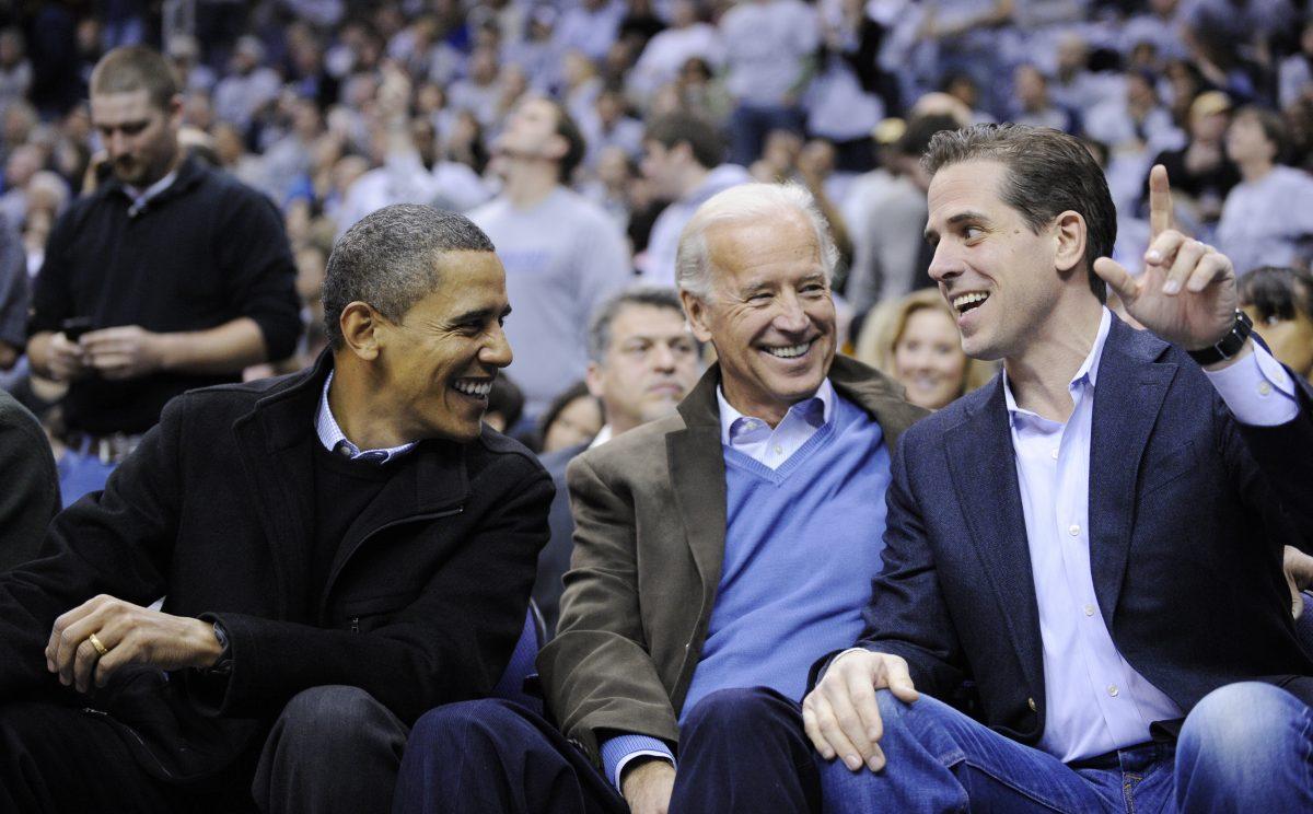 L-R: President Barack Obama, talks with Vice President Joe Biden, and his son Hunter Biden, at the Duke Georgetown NCAA college basketball game on Jan. 30, 2010, in Washington. (Nick Wass/AP Photo)
