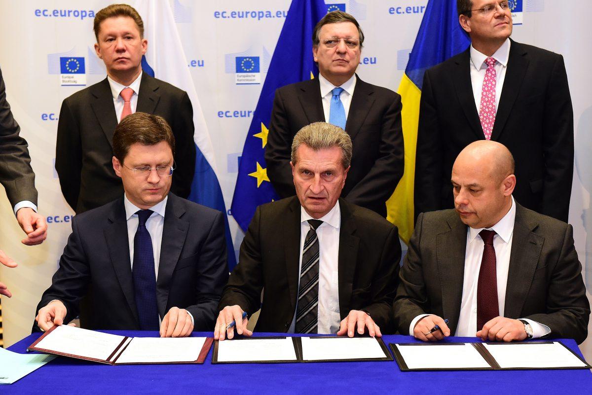 Russian Energy Minister Alexander Novak (L); European Union Commissioner for Energy Günther Oettinger (C); and Ukrainian Fuel and Energy Minister Yuriy Prodan (R) sign a gas agreement on Oct. 30, 2014, in Brussels. (Emmanuel Dunand/AFP/Getty Images)