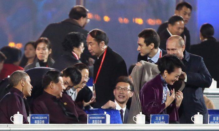 Chinese Media Censors Vladimir Putin for Giving Xi’s Wife His Coat