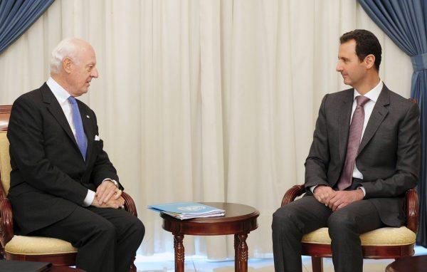 In this photo released by the Syrian official news agency SANA, Syrian President Bashar Assad, right, speaks with United Nations special envoy to Syria Staffan de Mistura in Damascus, Syria, Monday, Nov. 10, 2014. Assad said a cease-fire proposal for the embattled northern city of Aleppo, which was raised by de Mistura, was "worth studying," in remarks made to state-run media Monday. (AP Photo/SANA)