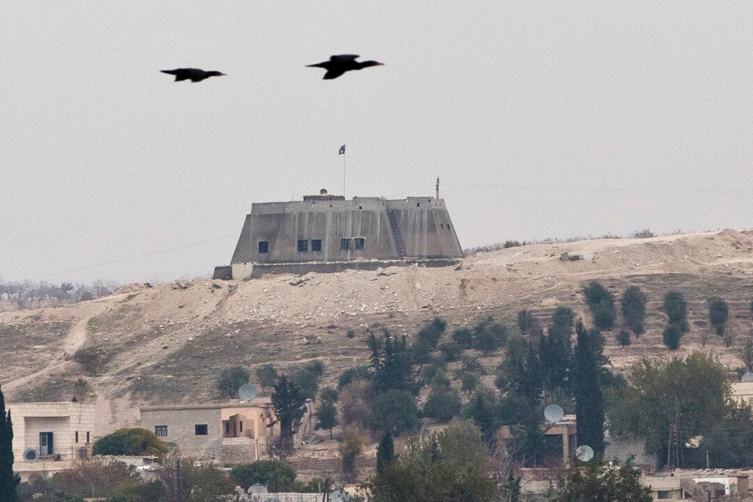 Archaeologists Dig at Ancient Site Near Syrian War