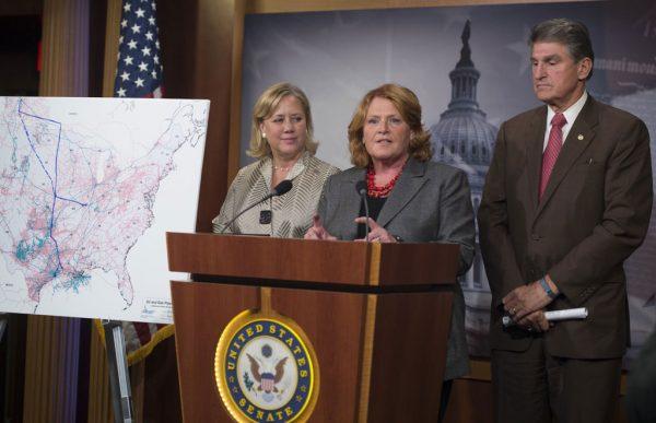 Senator Heidi Heitkamp (D-N.D.), center, speaks alongside other Senators in a 2014 file photo. (Saul Loeb/AFP/Getty Images)