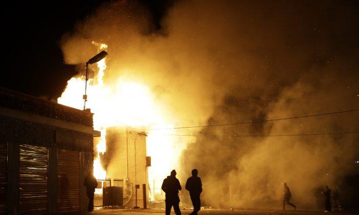 West Florissant Avenue in Ferguson, MO: Protestors Burn Buildings, Including The Original Red’s BBQ