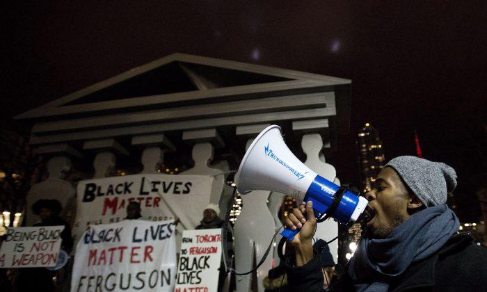 Thousands Hold Vigil in Toronto for Slain Ferguson Teenager