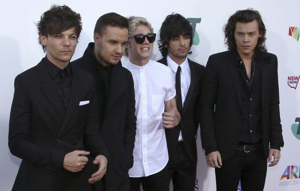 Boy band One Direction, from left to right, Louis Tomlinson, Liam Payne, Niall Horan, Zayn Malik, and Harry Styles arrive for the Australian Recording Industry Association (ARIA) awards in Sydney, Wednesday, Nov. 26, 2014. (Rick Rycroft/AP Photo)