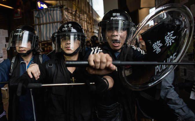 Here’s Why Hong Kong Police Are Beating Umbrella Protesters