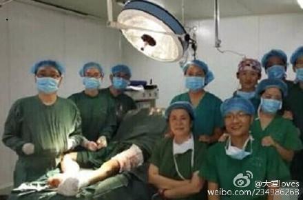 Chinese Doctors Pose for Pictures During Surgery
