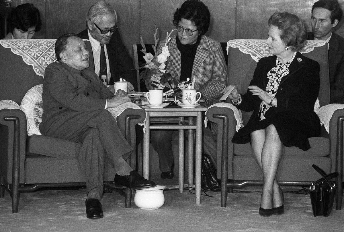Chinese leader Deng Xiaoping (L) meeting the then British Prime Minister Margaret Thatcher in Beijing on Dec. 19, 1984. (Pierre-Antoine Donnet/AFP/Getty Images)