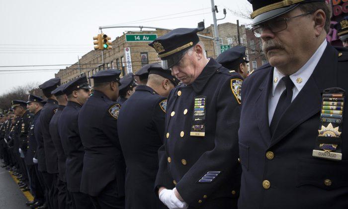 Mayor Eulogizes Officer as Cops Outside Turn Backs
