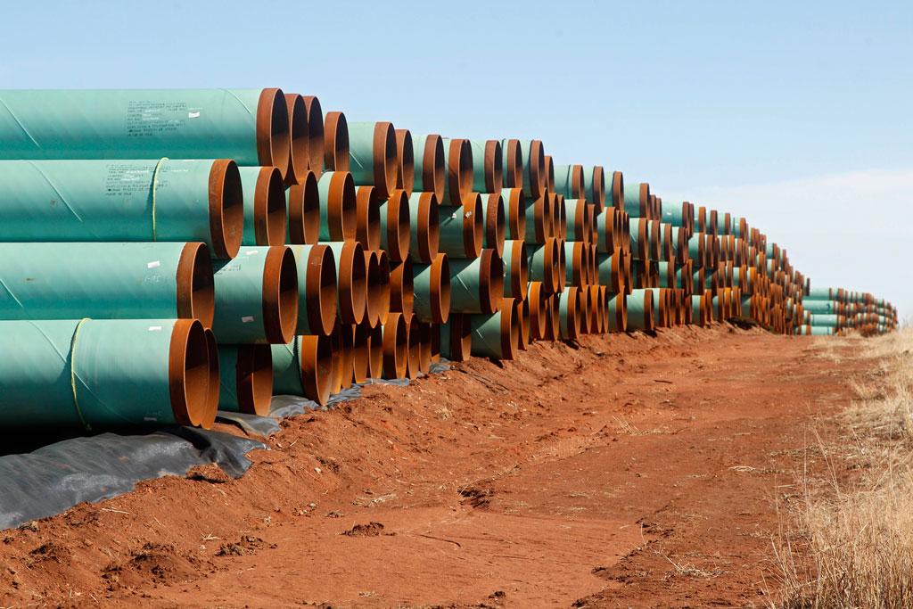 Miles of pipe ready to become part of the Keystone Pipeline are stacked in a field near Ripley, Oklahoma on Feb. 1, 2012. (AP Photo/Sue Ogrocki)