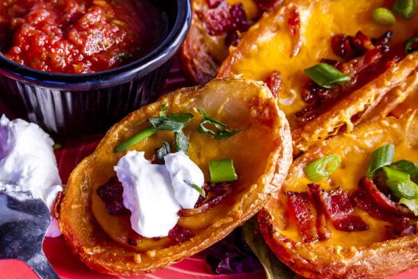 Don't toss those potato skins—load them with cheese and bacon bits and crisp them up in the oven. (Teri Virbickis/Shutterstock)