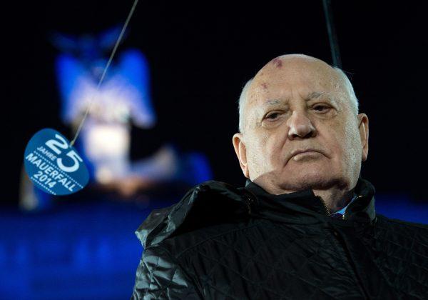 Former leader of the Soviet Union Mikhail Gorbachev takes part in the celebration on the occasion of the 25th anniversary of the fall of the Berlin Wall in front of the Brandenburg Gate in Berlin, Germany, Nov. 9, 2014. (AP Photo/dpa, Bernd von Jutrczenka)