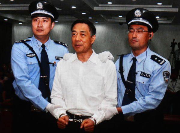 Former Chinese Politburo member Bo Xilai (C) on Sept. 22, 2013, in handcuffs in Beijing, China. Bo plotted with Zhou Yongkang, the former security boss, according to recent reports. (Feng Li/Getty Images)